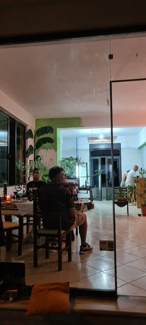 The restaurant. Julian and Mônica cooking for us at Green Life Market in Sarande