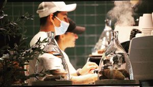 Baristas service single origin specialty coffee  at Pawdy Neighbors  in Dubai