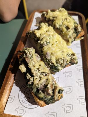 Vegan pizza with tofu at Pawdy Neighbors  in Dubai