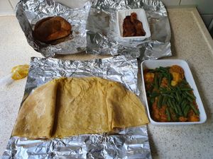 'Vegetarische roti' with masala potato and long bean with top left the bara and top right the baked banana at Shivani's Surinaams Eethuis in Enschede