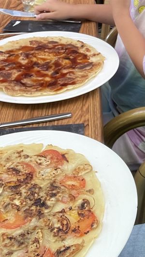 1 sweet pancake with apple banana cinnamon and stroop, 1 savory with onions mushrooms and tomato.  at De Pannekoek in Apeldoorn