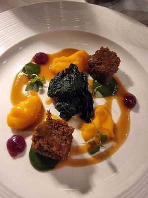 Grilled Lentils Seitan, Carrot Topping, Black Cabbage, Onion Jam, Saffron and Ginger Dressing   at L'Evangelista Ristorante & Enoteca in Verona