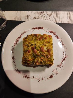 Sformato di patate, carciofi, scamorza affumicata e pistacchi at Osteria di Fuori Porta in Padua
