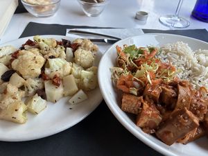 Korean style tofu with a side of grilled cauliflower with olives and sundried tomatoes.   at Osteria di Fuori Porta in Padua