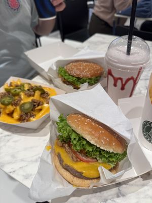 Smoky Bakon burger, cheesy fries & strawberry shake.  at Vegan Burger - Dubai Mall in Dubai
