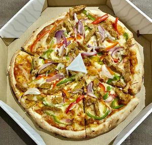 Tandoori pizza at Vegan Burger - Dubai Mall in Dubai