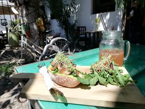 Vegan avo toast with salad and strawberry soda at El Local in Antigua