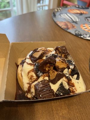 Custom Roll (cake batter frosting, peanut butter cups, Oreo bites, chocolate sauce)  at Cinnaholic in Raleigh