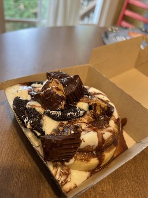 Custom Roll (cake batter frosting, peanut butter cups, Oreo bites, chocolate sauce)  at Cinnaholic in Raleigh