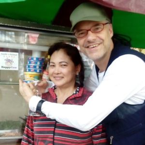 Mrs Dinh very pleased with the Happy Cow sticker at Chay Banh Mi - Food Cart in Nha Trang