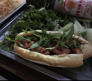 vegan baguette with slices of tomato at Chay Banh Mi - Food Cart in Nha Trang