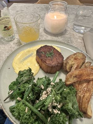 Vegan steak with crunchy greens, garlic sauce and patatoe wedges  at Bistro Verde in Copenhagen