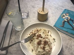 Vegan carbonara-style pasta with creamy cashew sauce, topped with vegan parmesan and bacon (+homemade lemonade!)  at Bistro Verde in Copenhagen