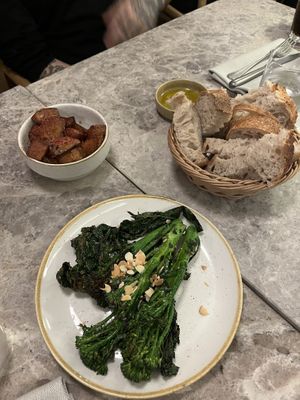 Roasted potatoes, bread and oil, and broccolini.   at Bistro Verde in Copenhagen