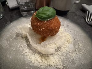 fried risotto ball on rice cracker, cheesy melt insidee  at Bistro Verde in Copenhagen
