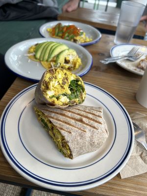 Vegan breakfast burrito. Tacos in the background.  at Clementine Bakery in Brooklyn