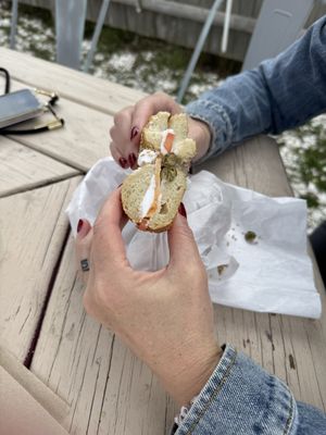 Sesame seed bagel with vegan cream cheese, tomato & capers.  at Bagel Hound in Wellfleet