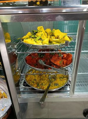 Dhokla, (two varieties), Sev Khamni (bottom) at Ghee Gud in Ahmedabad