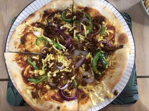 Pizza special - taco m*nce, red onion & green pepper  at The New Denver in Cullen