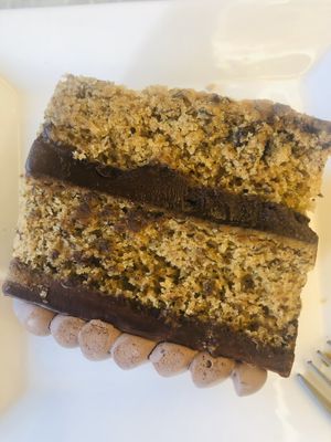 Delicious banana fudge with layers of ganache, served desserts lying on the side, maybe from previous toppling experience?  at Delcie's Desserts and Cakes in Central Singapore