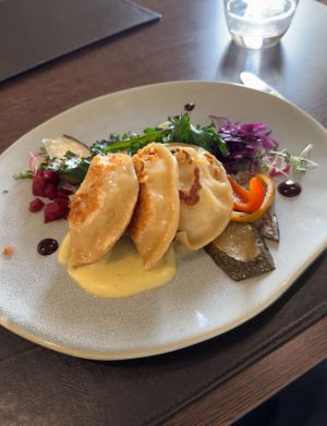 Smoked Potato & Fermented Cabbage Pierogi, Roast Onion, Creamy Aubergine Puree   at Poacher Restaurant in Ballina