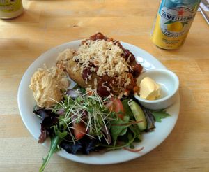 Jacket Potato with five-bean chilli, vegan cheese, vegan spread, houmous & salad at Eat at The Park in Hastings