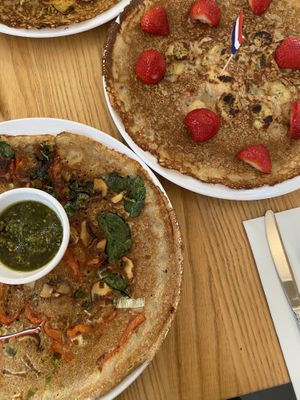 Savory pesto, sweet banana pancake with strawberries   at Pancakes - Westermarkt in Amsterdam