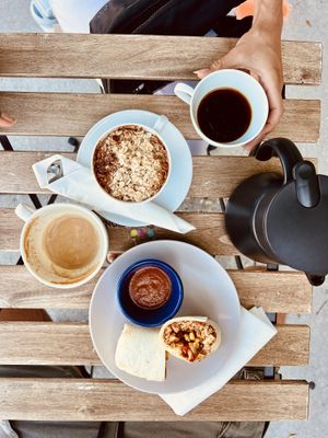 Oatmeal and burrito - oat milk latte and house coffee  at Elevation Coffee in Tampa