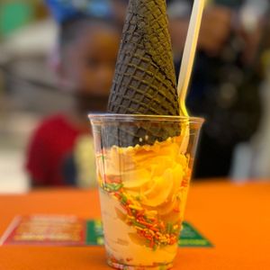 Birthday cake ice cream cup with a chocolate waffle cone  at Sun Of A Vegan in Memphis
