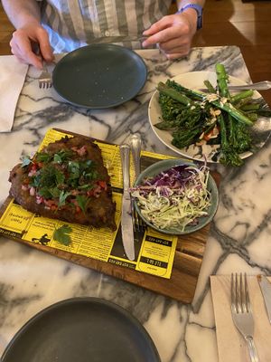 aubergine schnitzel with slaw and broccolini dish  at Espécie in Porto