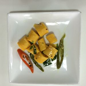 Khandvi is made with chick pea flour, yogurt & turmeric. Vegan option available. at The Ganga Cafe @ BANGSAR in Kuala Lumpur