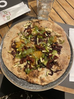 Vegan 2: caramelized onions, zucchini, pumpkin cream, pesto, dried tomatoes and hummus  at Pizza 20e20 in Udine