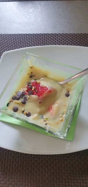 Custard with fruit, nuts and chocolate chunks (picture taken after started eating it) at La Rotonda in Tirano
