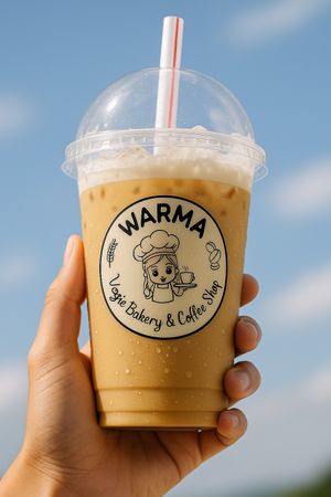 Iced Capuccino, optional plant-based milk (oat milk) - blend coffee from Origin Flores. Warma Vegie Bakery and Coffee Shop Ubud Bali 
 at WARMA - Vegie Bakery & Coffee Shop in Ubud