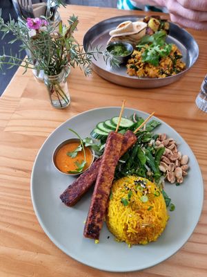 Satay tempeh with salad, and Indian tofu scramble, both so good! at Momo Wholefood in Newcastle