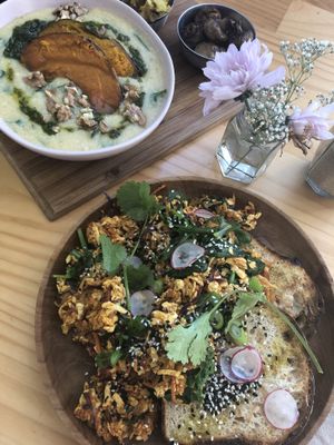 Tofu scramble and soft polenta with roast pumpkin, spinach and walnuts  at Momo Wholefood in Newcastle