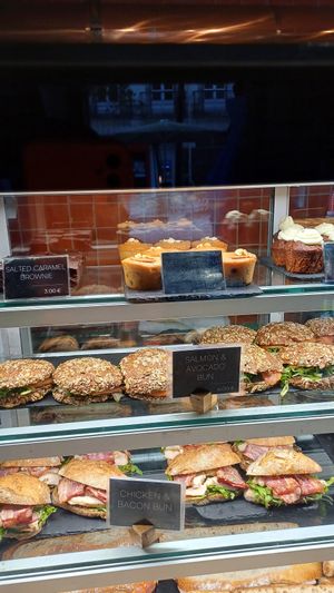 Vegan banana peanut cake at the middle of top shelf at Copenhagen Coffee Lab - Baixa in Lisbon