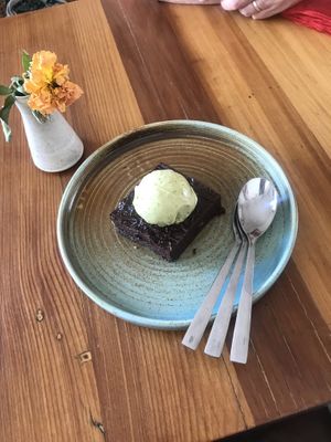 vegan brownie with vegan pistachio ice cream  at Orgánica Café & Tienda in Santiago