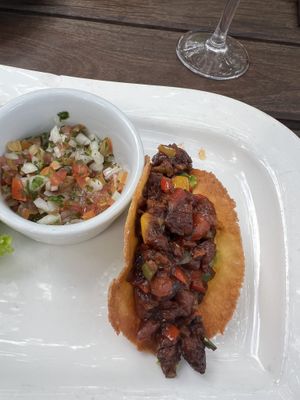 Spicy tomato refried bean taco (just ask for no sauce on top!) - only con is that they weren’t spicy at all 😂 but still very tasty!  at The River Brewery in Victoria Falls