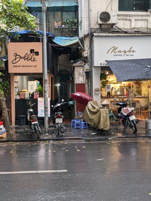 It's located down this alleyway, in between these 2 stores. at Quán Phở Chay anh Hải in Hanoi