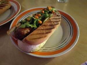 New menu: hot dog with curry sauce and sour berries. Awesome! at 2022_place - Pop Up in Yerevan