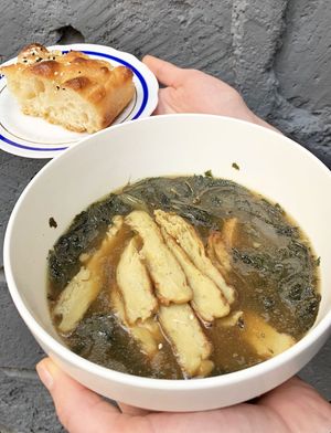 Vegan Molokhia Egyptian soup with “chicken” seitan and sesame flatbread at 2022_place - Pop Up in Yerevan