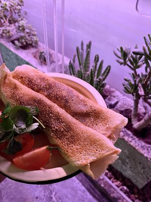 Delicious vegan crepes filled with Tom yam sauce, oyster mushrooms, rice mix, served with cilantro and cherry tomatoes at 2022_place - Pop Up in Yerevan