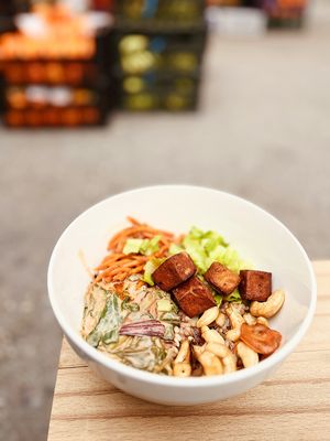 Yummy Nepal bowl: rice mix, fried cashew, curry greens, spice infused carrot, crunchy tofu at 2022_place - Pop Up in Yerevan