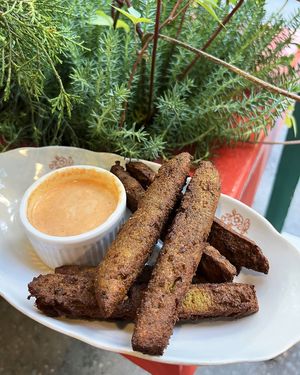 Panisse fries—deep fried chickpea sticks w/beer, garlic and spices served with kimchi aioli sauce at 2022_place - Pop Up in Yerevan