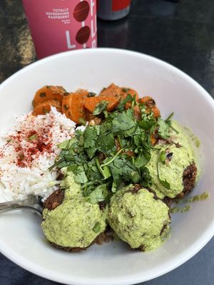 Falafel bowl with rice, spicy cabbage salad, pickled vegetables, vegan pesto, and cilantro at 2022_place - Pop Up in Yerevan