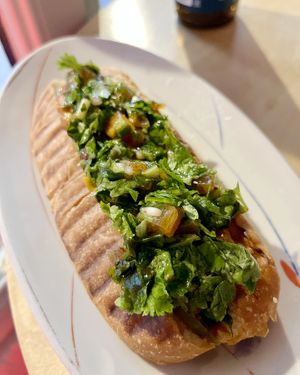 Curry hot dog with cilantro & dried apricots at 2022_place - Pop Up in Yerevan