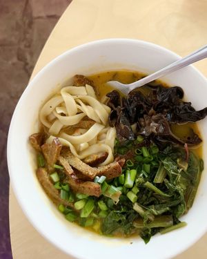 The greatest pumpkin Ramen: pumpkin, miso and ginger broth with homemade alkaline noodles + blanched spinach, seitan, pickled tree mushrooms, chili oil at 2022_place - Pop Up in Yerevan