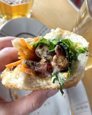 Banh mi sandwich: hoisin chick’n seitan tempura, marinated carrot, purple radish, cucumber, marol, sriracha and cashew aioli sauces at 2022_place - Pop Up in Yerevan