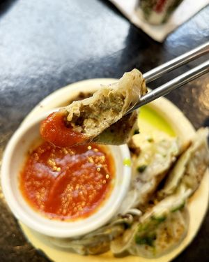 Vegan special gyoza with oyster mushrooms, champignons, tofu cream cheese, tomato sauce and mandak-kimchi amuse-bouche on the side. at 2022_place - Pop Up in Yerevan